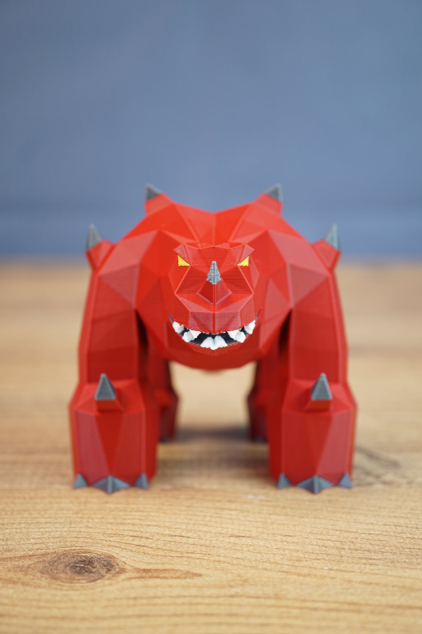 Low poly 3D printed fantasy creature displayed on wooden table