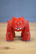 Low poly 3D printed fantasy creature displayed on wooden table