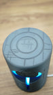 Top angled view of the Knowledge Stone gaming lamp with blue LED illumination and detailed circular sci-fi pattern across the top surface.