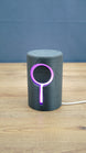 Knowledge Stone RGB LED gaming light illuminated purple around the circular centre and vertical light channel on a dark grey sci-fi body.