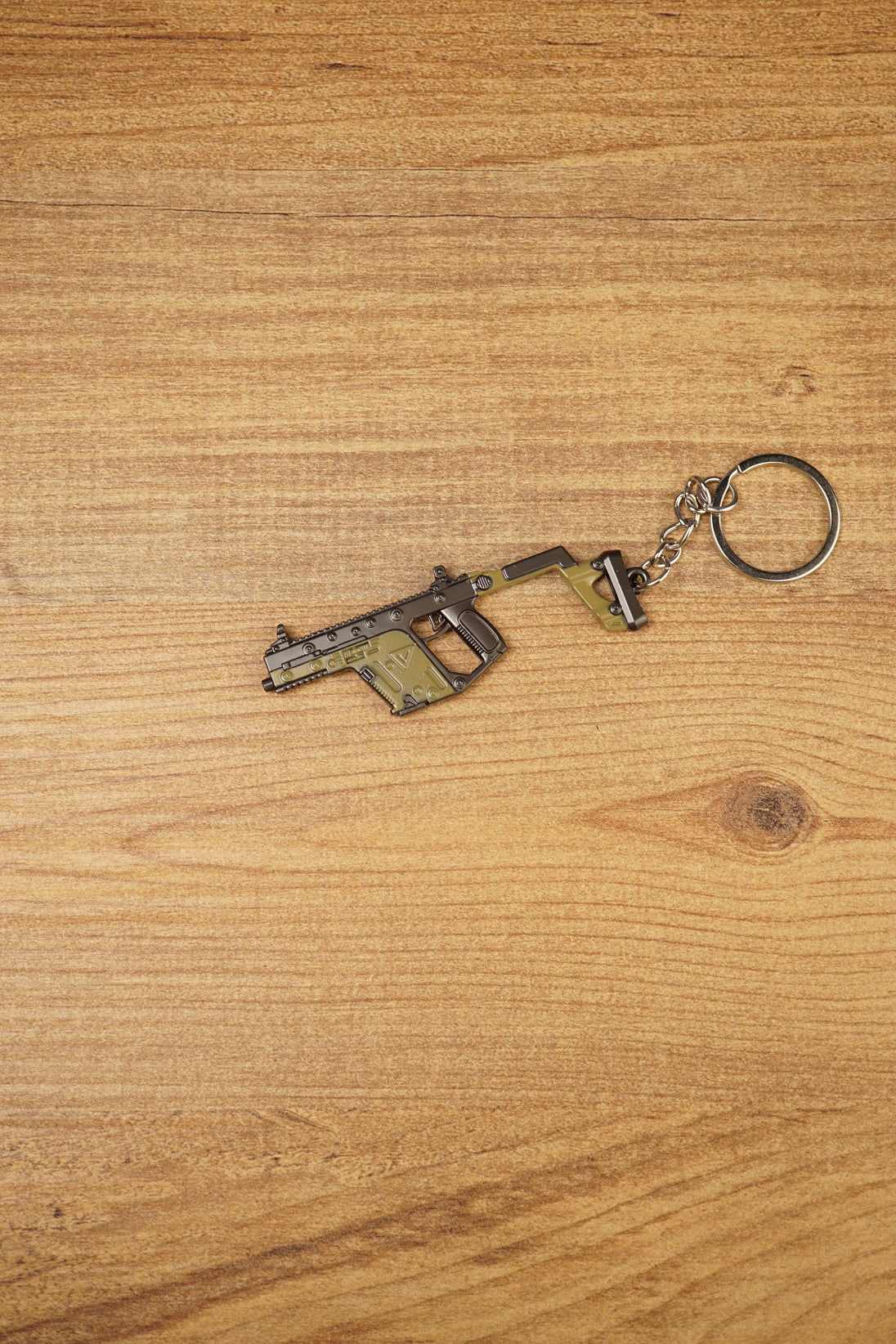Side view of KRISS Vector Gen 2 inspired gun keychain with metal ring and chain, perfect for backpacks, keys and gaming setups