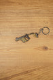 Side view of KRISS Vector Gen 2 inspired gun keychain with metal ring and chain, perfect for backpacks, keys and gaming setups