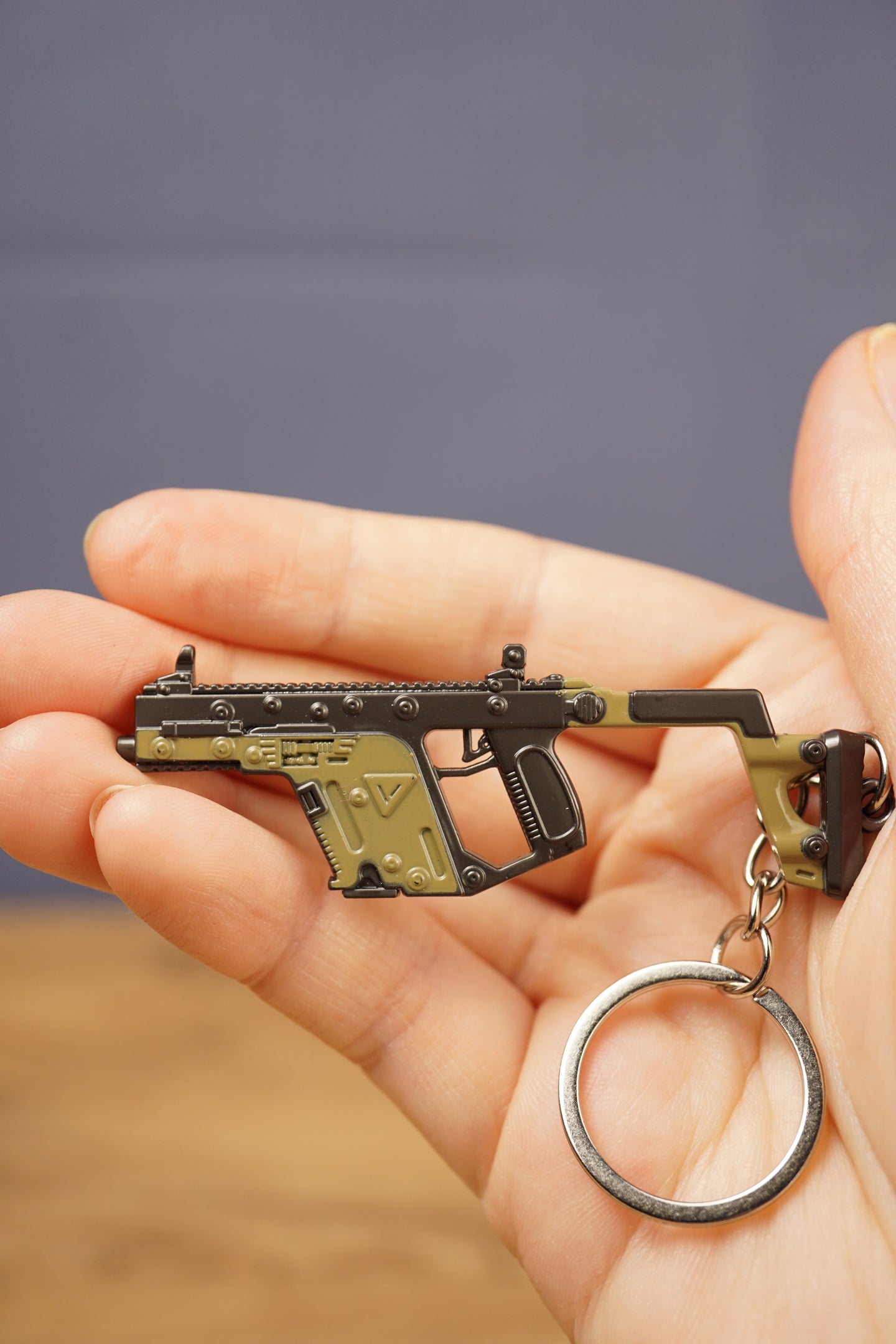 KRISS Vector Gen 2 inspired tactical gun keyring held in hand with metal key loop, a unique gift for FPS and mil-sim gaming fans