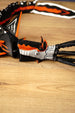 Detailed side close-up of the Needler Mango creature model, highlighting its white facial armour, orange crest, black jaw and moving mouth mechanism.