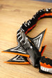 Close-up of the Needler Mango model’s layered fins, featuring black surfaces, white patterns and bright orange edges beside the segmented body.