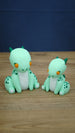 Nibbles the Drake Palia inspired collectible figures in 7cm and 9cm sizes, featuring mint green bodies, orange eyes and dark green spotted details