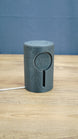 No Man’s Sky inspired Knowledge Stone LED light shown unlit on a wooden desk, featuring a dark grey sci-fi cylindrical body and engraved alien details.