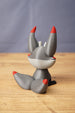 Rear view of Obsidian Kitsuu figure showing grey curled tail, red tail tip, tall ears and white back head detail