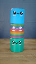 Stacked Palia Cyl Cylinder Collectibles showing the blue, rainbow, and green color versions.