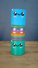 Stacked Palia Cyl Cylinder Collectibles showing the blue, rainbow, and green color versions.