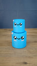 Small blue Palia Cyl Cylinder Collectible stacked on top of the larger blue version.
