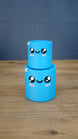 Small blue Palia Cyl Cylinder Collectible stacked on top of the larger blue version.