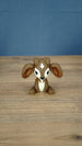Elder Sernuk-inspired Palia plush figure shown from the front on a wooden tabletop.