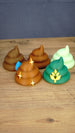 Collection of five Palia fertilizer figures and magnets featuring HarvestBoost, HydratePro, QualityUp, SpeedyGro and WeedBlock designs on a wooden surface.