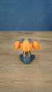 Rear view of the Golden Sernuk-inspired plush figure showing gray body details and rounded tail.