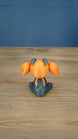 Rear view of the Golden Sernuk-inspired plush figure showing gray body details and rounded tail.