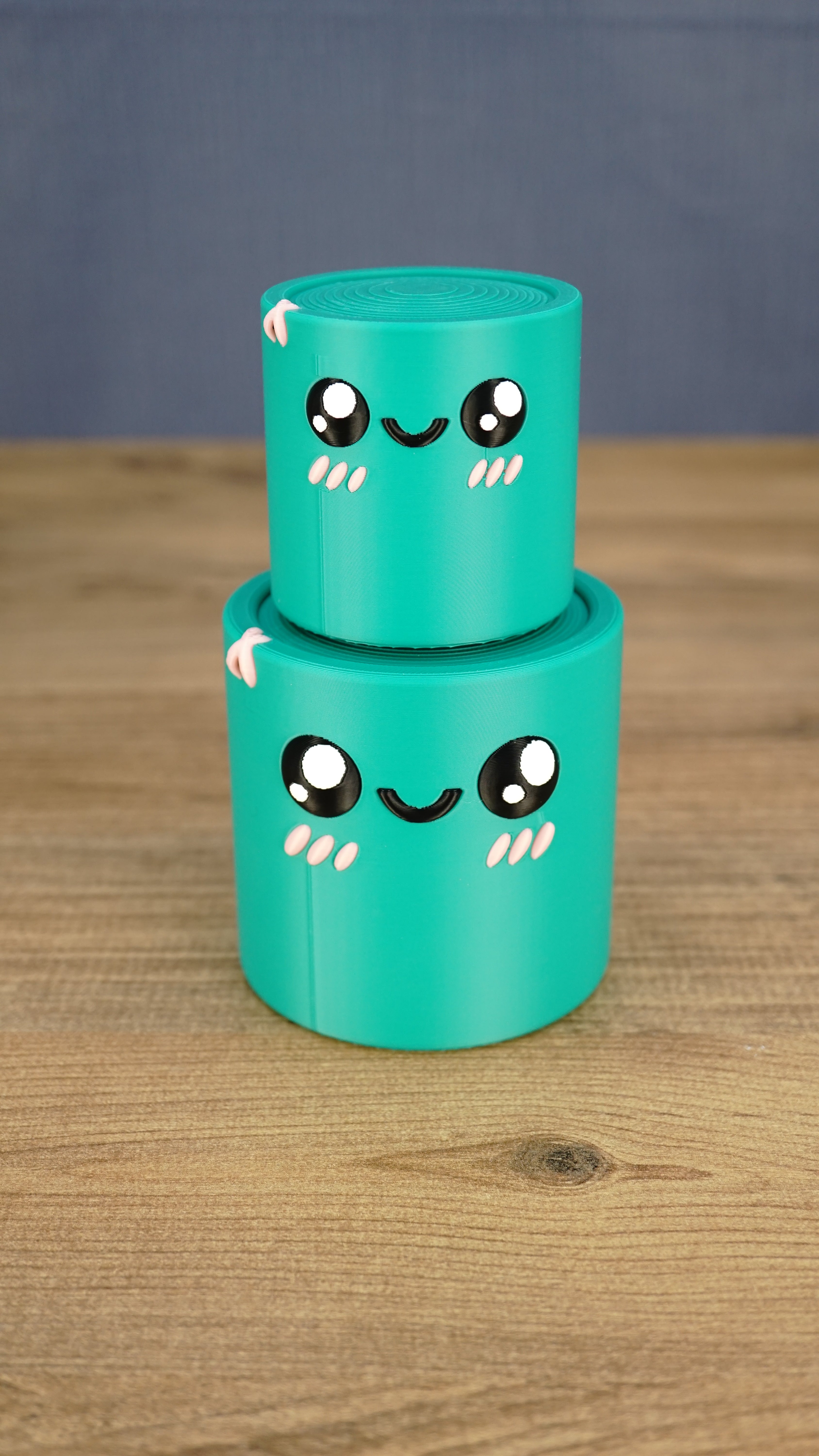 Small teal Palia Green Cylinder plush stacked on top of the larger size, showing both 3D printed size options.