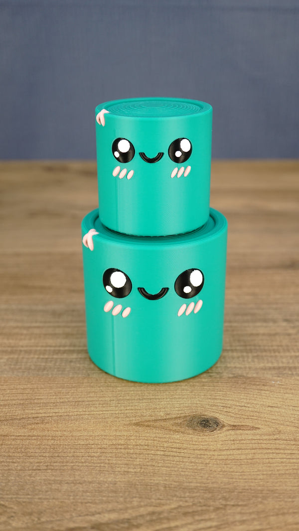 Small teal Palia Green Cylinder plush stacked on top of the larger size, showing both 3D printed size options.