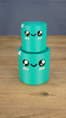 Small teal Palia Green Cylinder plush stacked on top of the larger size, showing both 3D printed size options.