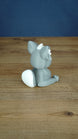 Back side view of a grey 3D printed Palcat plush figure showing its curled white-tipped tail, large ears, and seated pose.