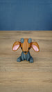 Front view of the Highlands Sernuk-inspired plush figure with blue and dark gray coloring.