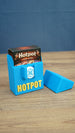 Open blue Palia Hotpot storage box holding the mini card game box, with the removable lid placed beside it.