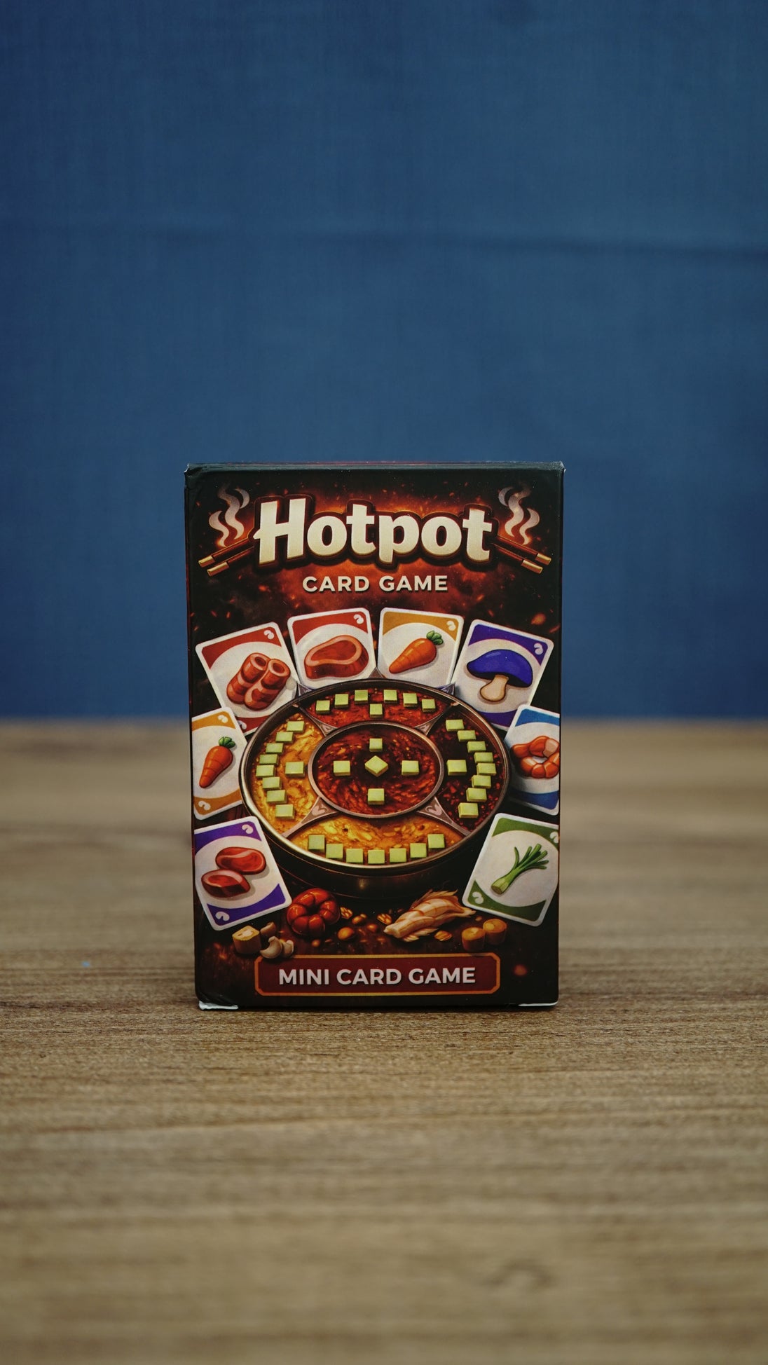 Palia-inspired Hotpot card game in compact storage box featuring colorful ingredient cards and hot pot artwork on the front packaging.
