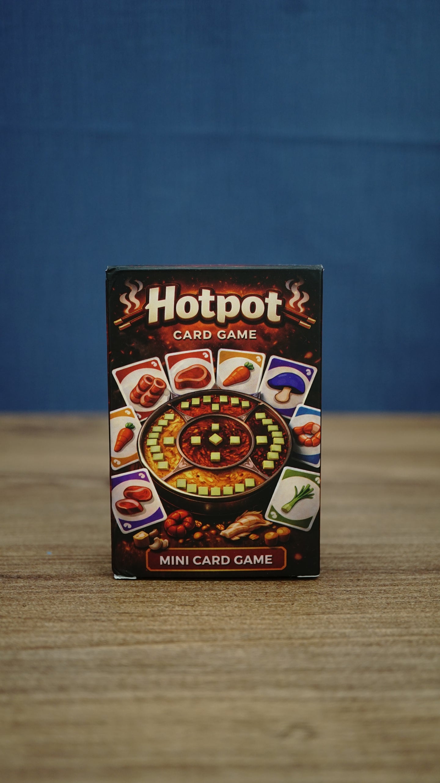 Palia-inspired Hotpot card game in compact storage box featuring colorful ingredient cards and hot pot artwork on the front packaging.