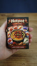 Compact Palia-inspired Hotpot card game box held in hand to show the portable size, detailed artwork, and mini card game packaging.