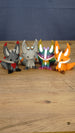 Close-up group photo of four Palia Kitsuu figure variants, including Obsidian, Caldera, Rainbow, and Ancient styles.