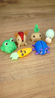 Angled view of six Palia-inspired Li’l Plushies miniatures featuring Li’l Froggy, Sernuk, Turnip, Snail, Carrot and Beetle.