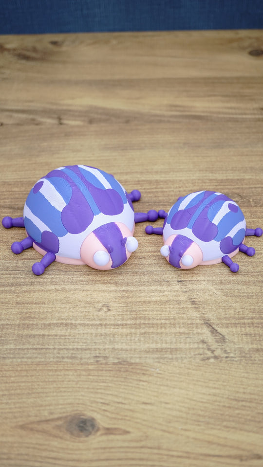 Small and large Palia Princess Ladybug plush figures displayed together, showing the purple, pink, white and blue design in 8cm and 11cm sizes