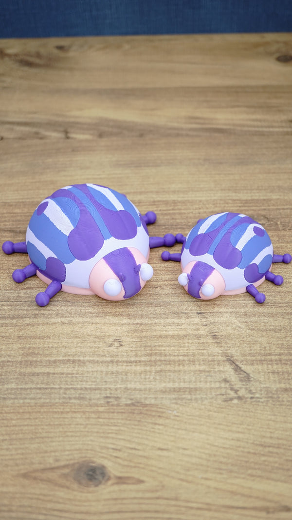 Small and large Palia Princess Ladybug plush figures displayed together, showing the purple, pink, white and blue design in 8cm and 11cm sizes