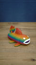 Large rainbow Palia Prismfish 3D printed figure shown from the side, with orange, green, blue, and purple colouring.