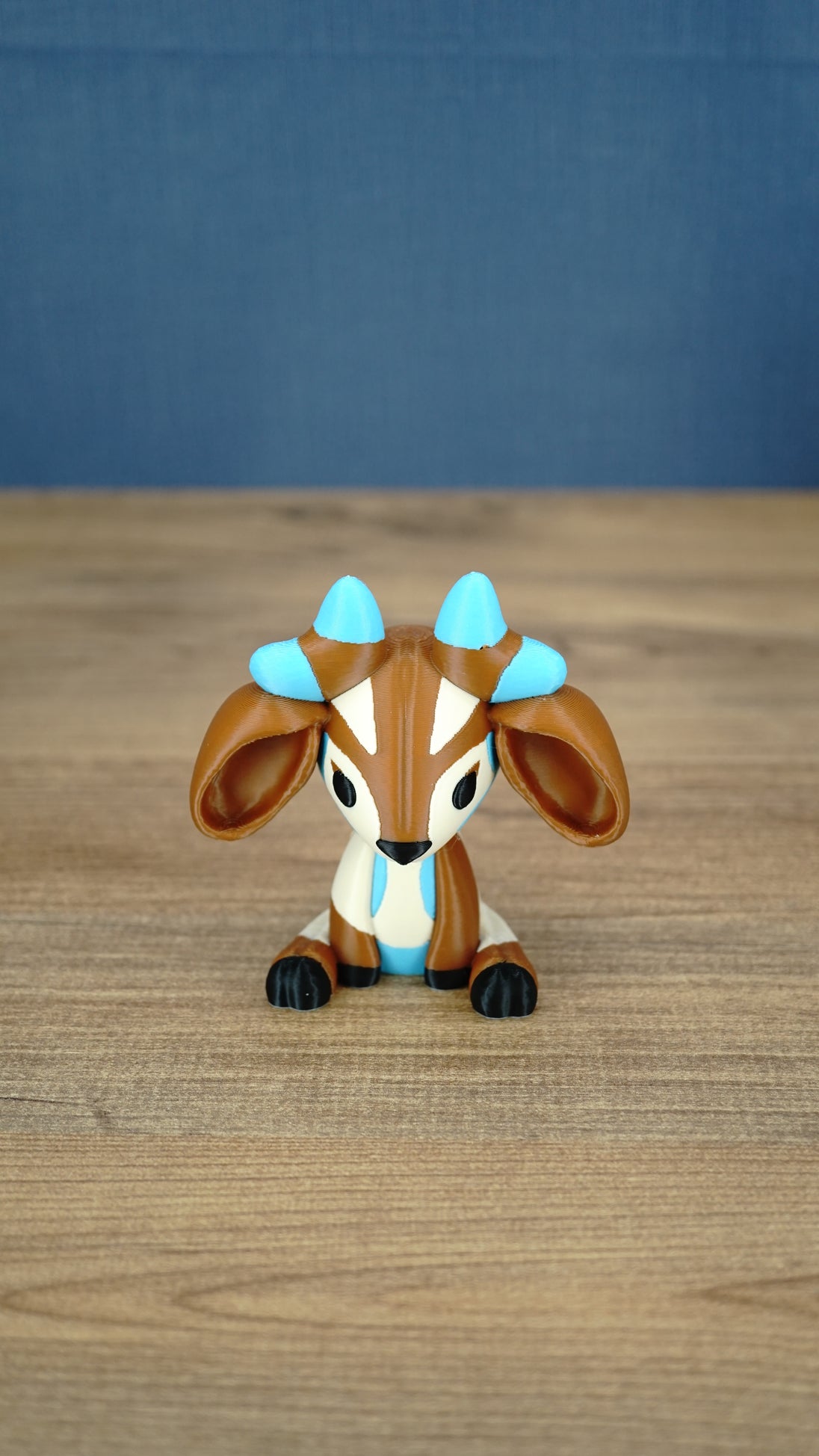 Front view of the Proudhorned Sernuk-inspired plush figure with large ears and blue horn tips.