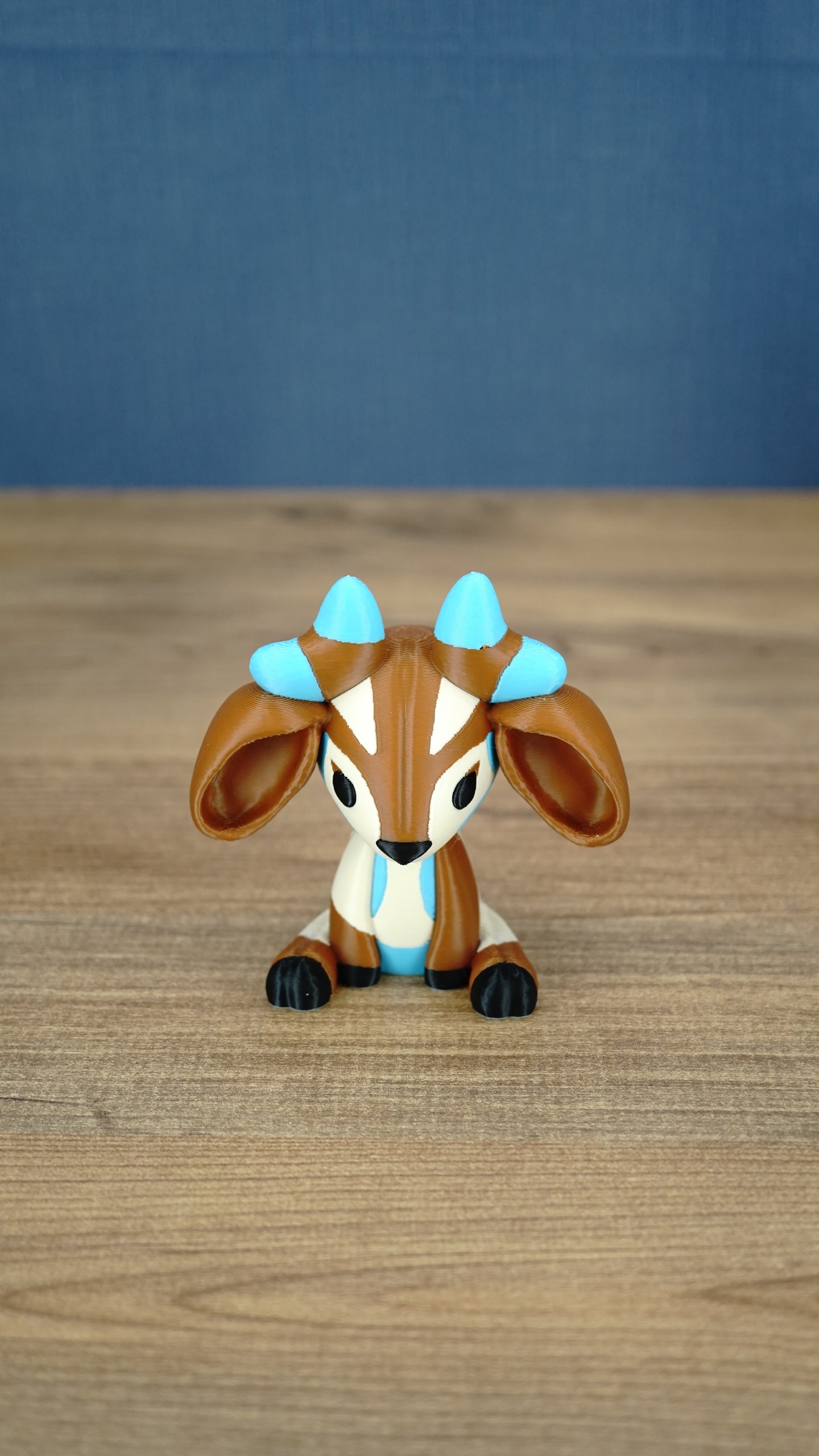 Front view of the Proudhorned Sernuk-inspired plush figure with large ears and blue horn tips.