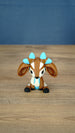 Front view of the Proudhorned Sernuk-inspired plush figure with large ears and blue horn tips.