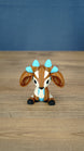 Front view of the Proudhorned Sernuk-inspired plush figure with large ears and blue horn tips.