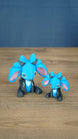 Two Royal Sernuk plush figures from Palia displayed together, showing the large and small 3D printed collectible versions.