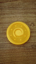 Close-up of a fan-made Palworld Gold Coin replica with a shimmering gold silk finish, approximately 4 cm in size, designed as a gaming collectible.