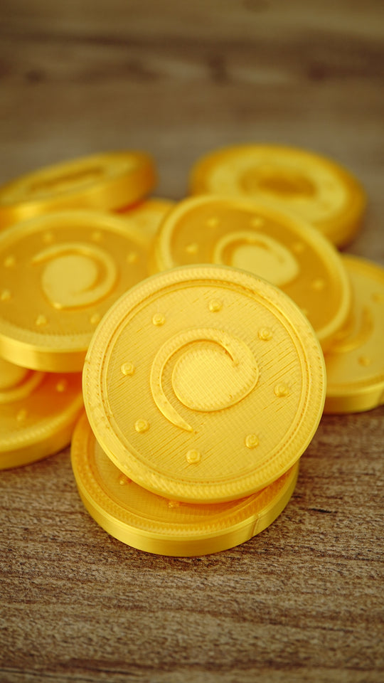 Stack of fan-made Palworld Gold Coin replicas showing the metallic-style gold silk finish, suitable for gaming displays, cosplay props or themed collections.