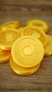 Stack of fan-made Palworld Gold Coin replicas showing the metallic-style gold silk finish, suitable for gaming displays, cosplay props or themed collections.
