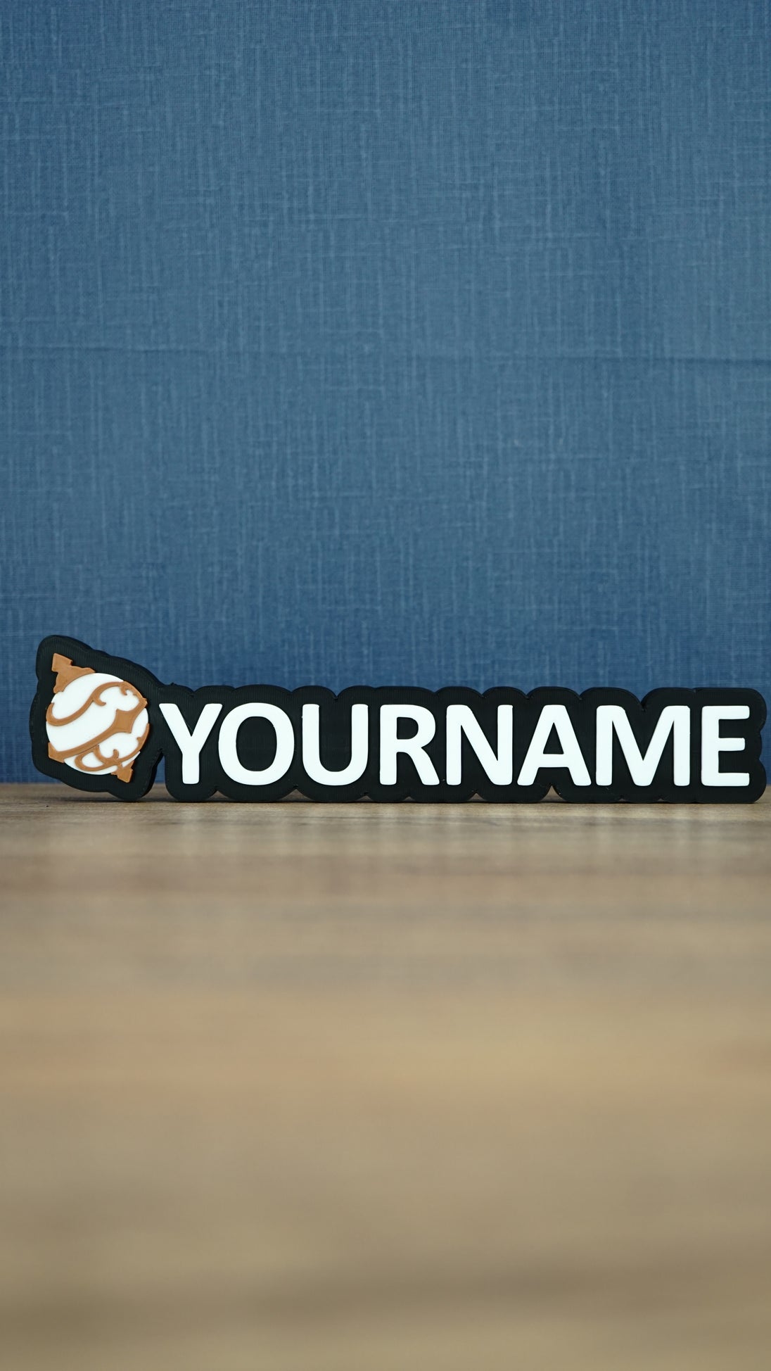 Front view of a white and bronze Palworld Sphere personalised nameplate on a black base, with bold YOURNAME lettering for gaming room display.
