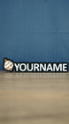 Front view of a white and bronze Palworld Sphere personalised nameplate on a black base, with bold YOURNAME lettering for gaming room display.