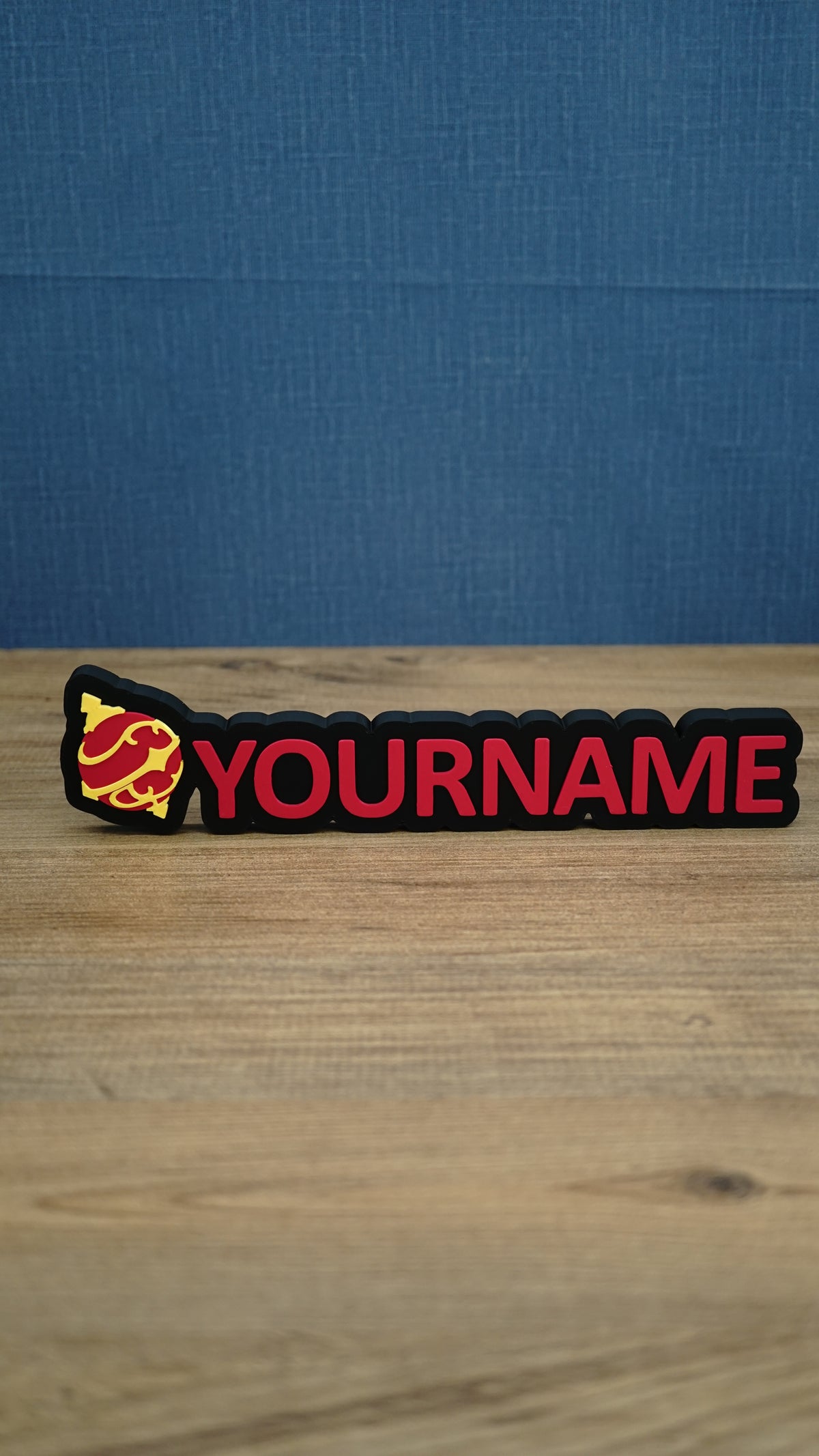 Personalised Palworld Sphere nameplate in pink  on a black base, shown front-on with bold custom YOURNAME lettering for a gaming desk.