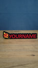 Personalised Palworld Sphere nameplate in pink  on a black base, shown front-on with bold custom YOURNAME lettering for a gaming desk.