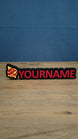 Personalised Palworld Sphere nameplate in pink  on a black base, shown front-on with bold custom YOURNAME lettering for a gaming desk.