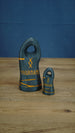 Two dark gray personalized Valheim-inspired tombstones in large and small sizes, with orange rune details and custom name text.