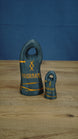 Two dark gray personalized Valheim-inspired tombstones in large and small sizes, with orange rune details and custom name text.