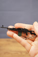 PKM metal rifle keychain held in hand with visible chain and detailed LMG body, perfect for tactical shooter fans and collector displays